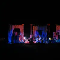 Stage with colorful lighting and curtains at night