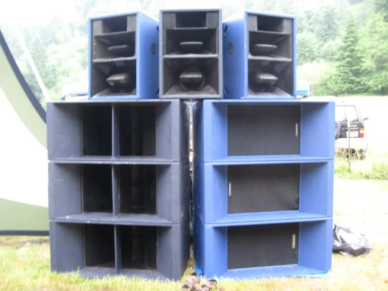Two large blue speaker stacks with smaller cabinets stacked on top